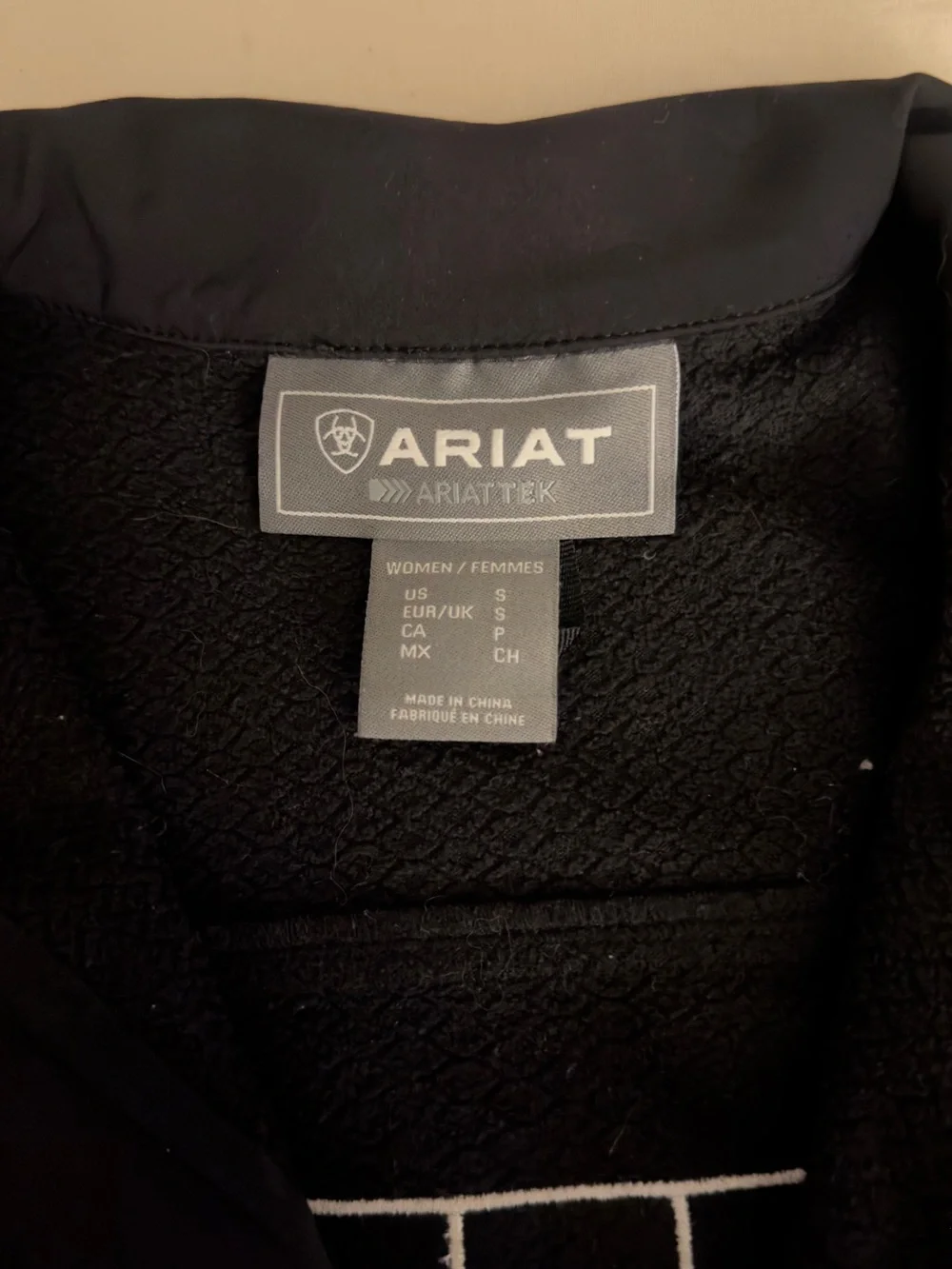 Women’s Ariat Black Softshell Jacket with Green, White & Red Sleeve Logo